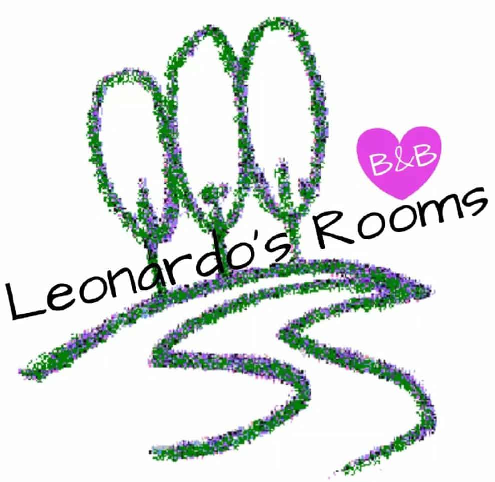 a logo with green and purple dots